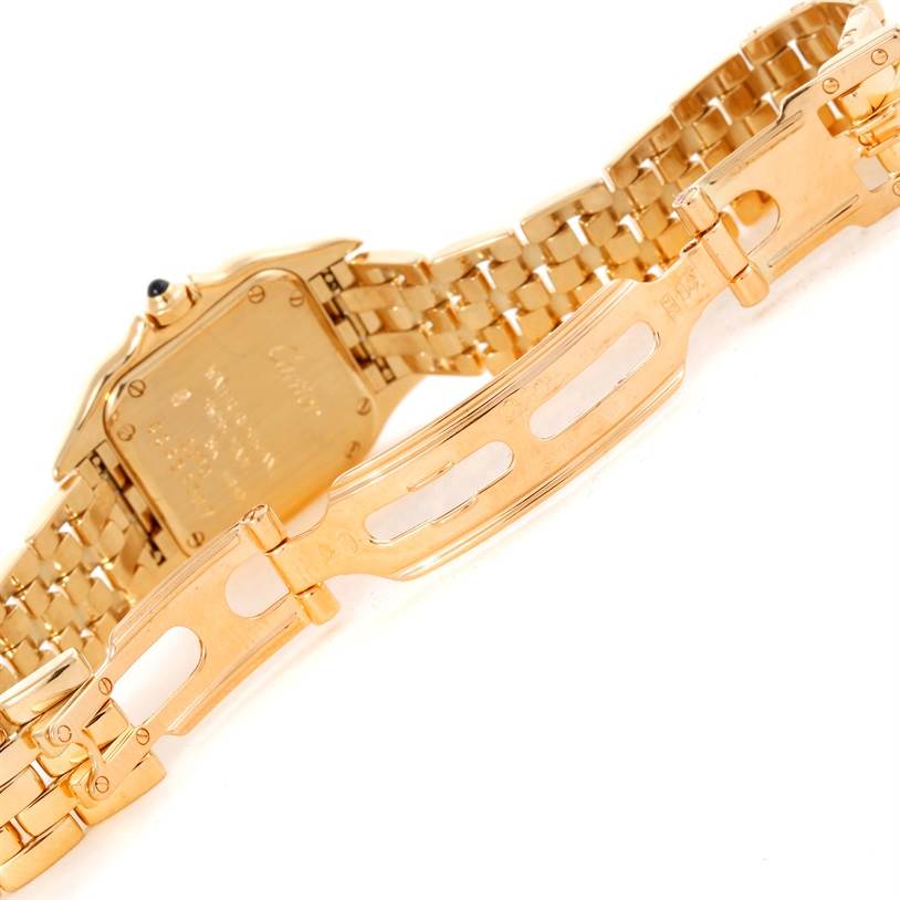 The image shows the back of the Cartier Panthere W25022B9 Women
s Yellow Gold Silver Dial W25022B9 Women
s Yellow Gold Silver Dial watch with its partially open gold bracelet clasp.