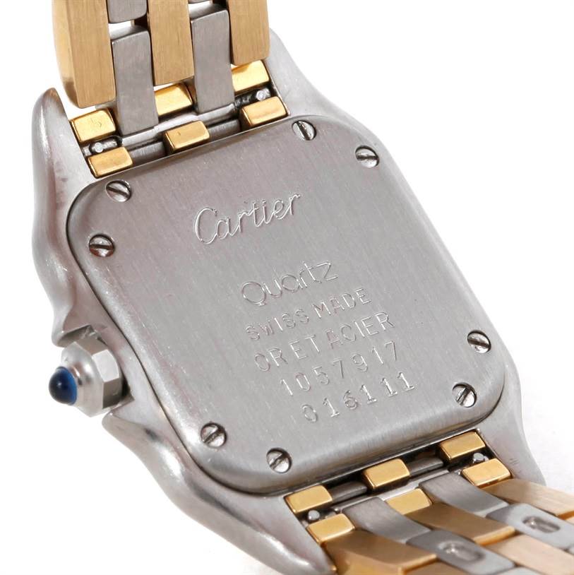 The image shows the back case and part of the bracelet of a Cartier Panthere W25029B6 Women's Stainless Steel Beige Dial W25029B6 Women's Stainless Steel Beige Dial watch, showcasing the brand engraving and serial details.