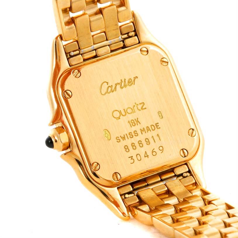 This image shows the back case and part of the bracelet of a Cartier Panthere W25022B9 Women's Yellow Gold Silver Dial W25022B9 Women's Yellow Gold Silver Dial Quartz watch in gold.