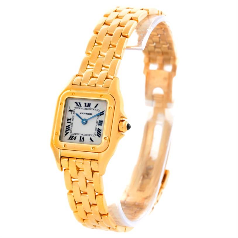 The Panthere de Cartier watch is shown at a three-quarter angle, highlighting the gold case, bracelet, and Roman numeral dial.