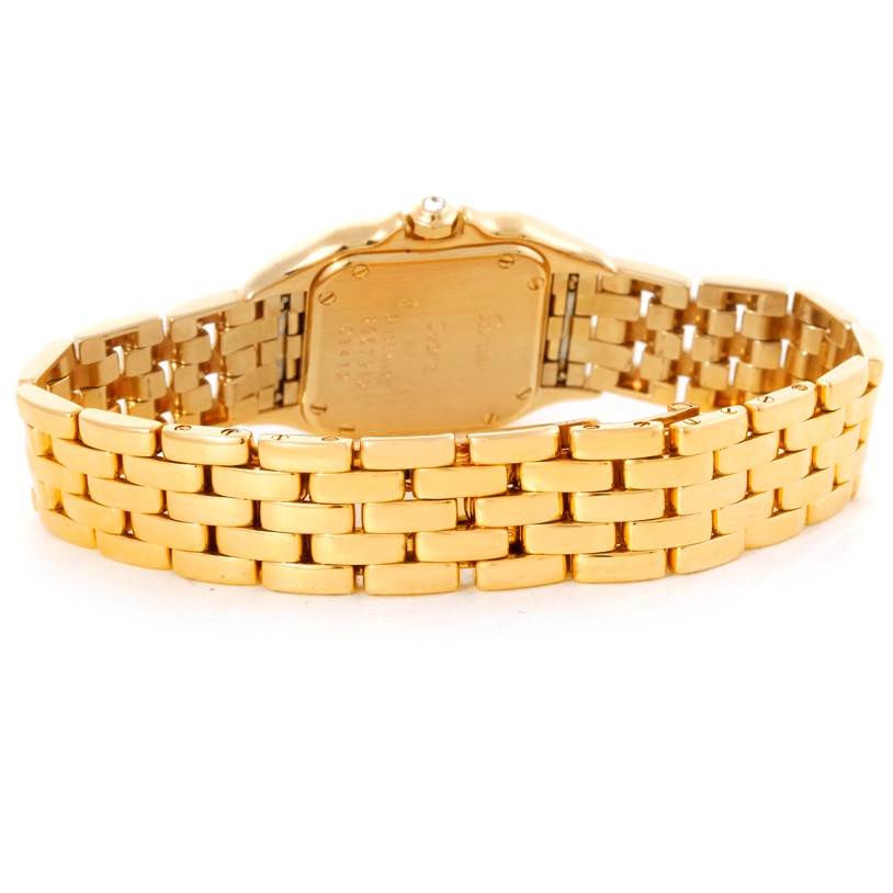 The image shows the back angle of a Cartier Panthere Women's Yellow Gold Champagne Dial Women's Yellow Gold Champagne Dial model watch, focusing on the case back and gold bracelet.