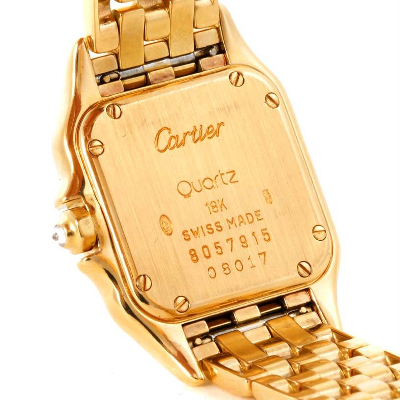The image shows the back case and part of the bracelet of a Cartier Panthere Women's Yellow Gold Mother of Pearl Dial Women's Yellow Gold Mother of Pearl Dial model watch.
