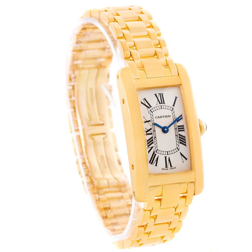The image shows a side angle of the Cartier Tank Americaine W26015K2 Women's Yellow Gold Silver Dial W26015K2 Women's Yellow Gold Silver Dial watch, highlighting the face, bracelet, and side crown.