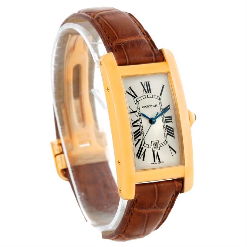 The Cartier Tank Americaine W2603556 Women's Yellow Gold Silver Dial W2603556 Women's Yellow Gold Silver Dial watch is shown at an angled view, highlighting its face, case, and brown leather strap.