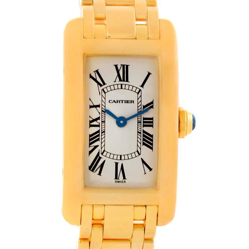 The Cartier Tank Americaine W26015K2 Women's Yellow Gold Silver Dial W26015K2 Women's Yellow Gold Silver Dial watch is shown from a front angle, displaying its face, case, and part of the bracelet.