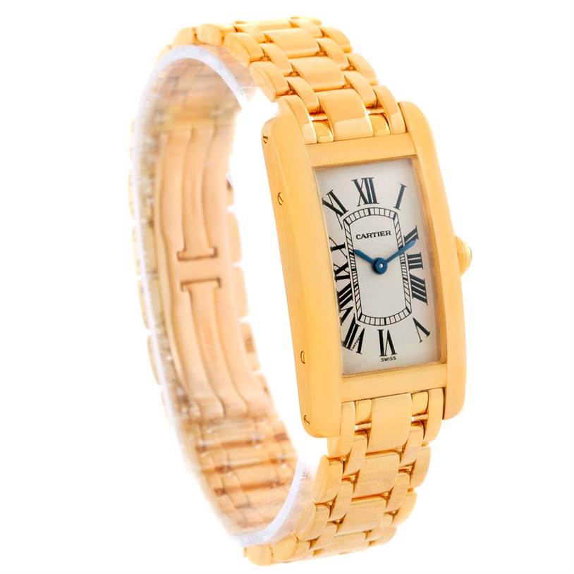 This image shows a Cartier Tank Américaine watch from a front-left angle showcasing its face, strap, and crown.