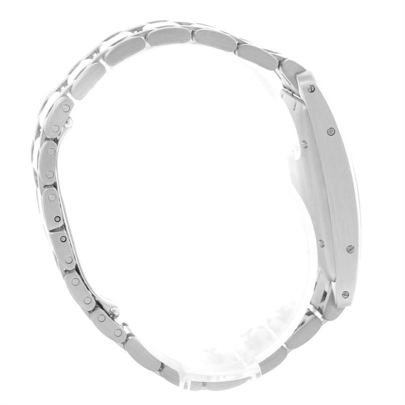 This side-angle view of the Cartier Tank Americaine W26036L1 Women's White Gold Silver Dial W26036L1 Women's White Gold Silver Dial watch shows the stainless steel bracelet and case side.