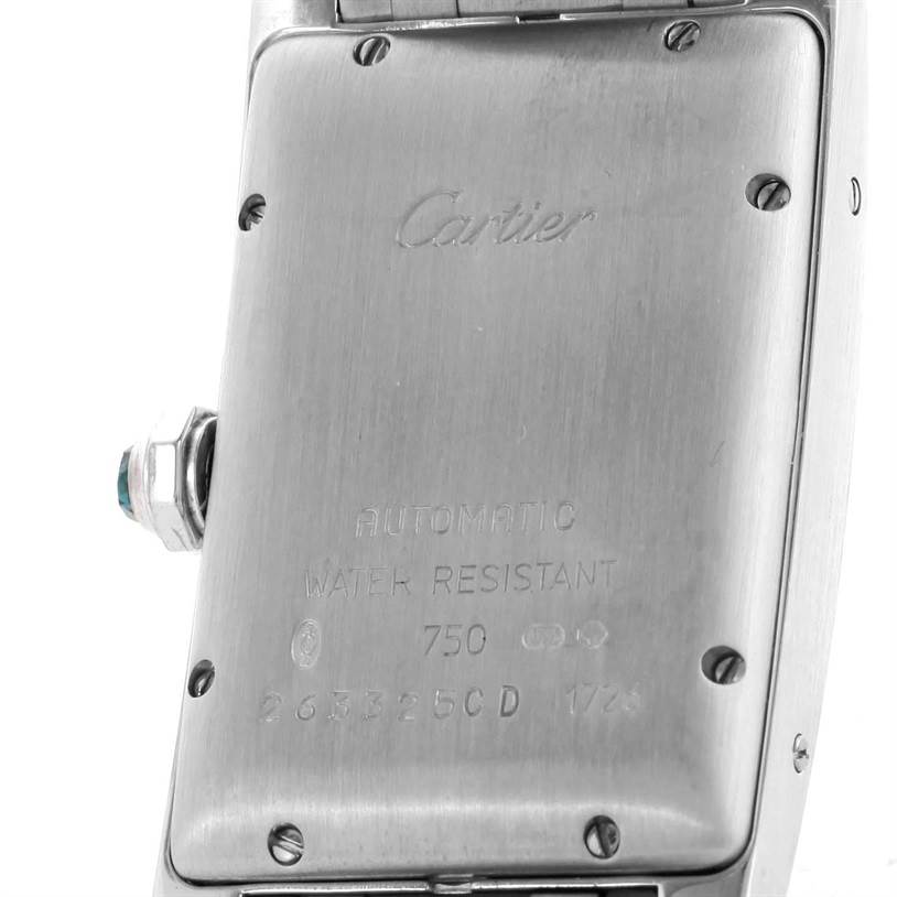 The image shows the back of a Cartier Tank Americaine W26036L1 Women's White Gold Silver Dial W26036L1 Women's White Gold Silver Dial watch, displaying its engraved details and screws.