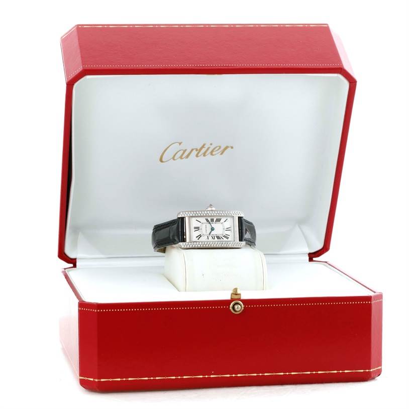 The Cartier Tank Americaine WB701851 Men's White Gold Silver Dial WB701851 Men's White Gold Silver Dial watch is shown front-facing in an open red box with a white interior.
