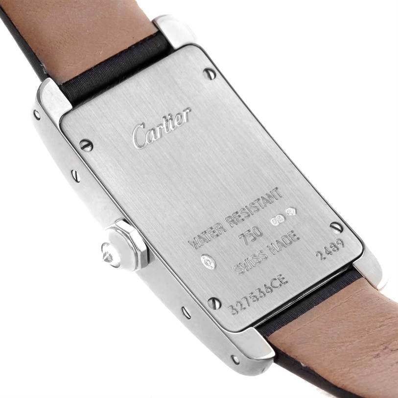 The Cartier Tank Americaine WB707331 Women
s White Gold Silver Dial WB707331 Women
s White Gold Silver Dial watch is shown from the back, highlighting its case, markings, and part of the leather strap.
