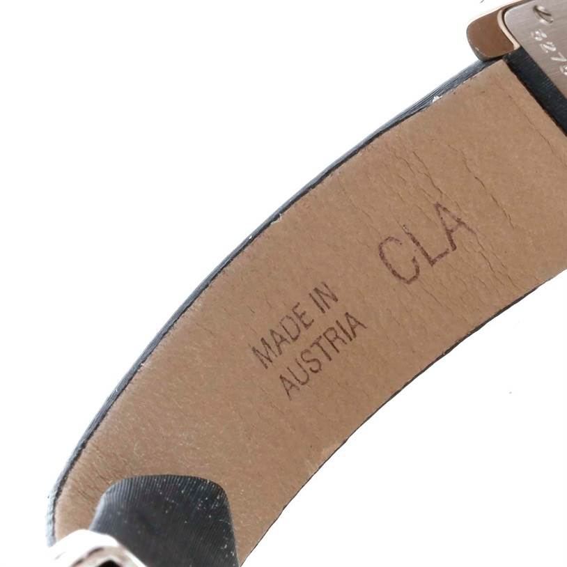 This image shows the interior strap of the Cartier Tank Américaine watch with "Made in Austria" and "CLA" marked on it.
