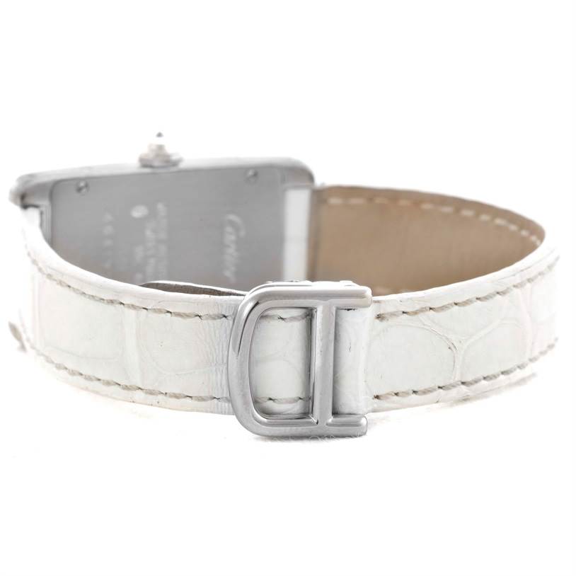 This image shows the back view of a Cartier Tank Americaine WB701851 Women
s White Gold Silver Dial WB701851 Women
s White Gold Silver Dial watch, focusing on the white leather strap and clasp.