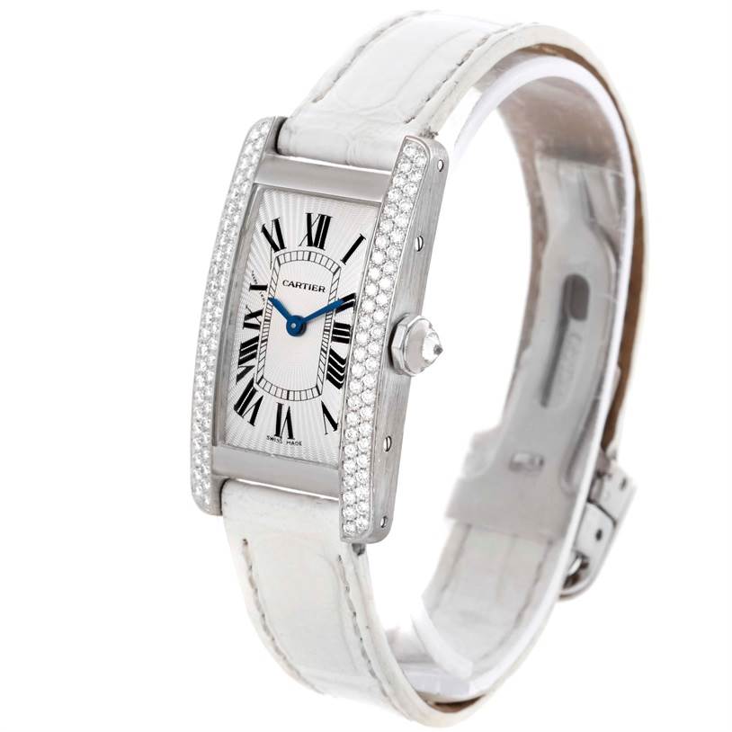 This image shows the Cartier Tank Americaine WB701851 Women
s White Gold Silver Dial WB701851 Women
s White Gold Silver Dial watch at a 3/4 angle, displaying the face, bezel, crown, and strap.