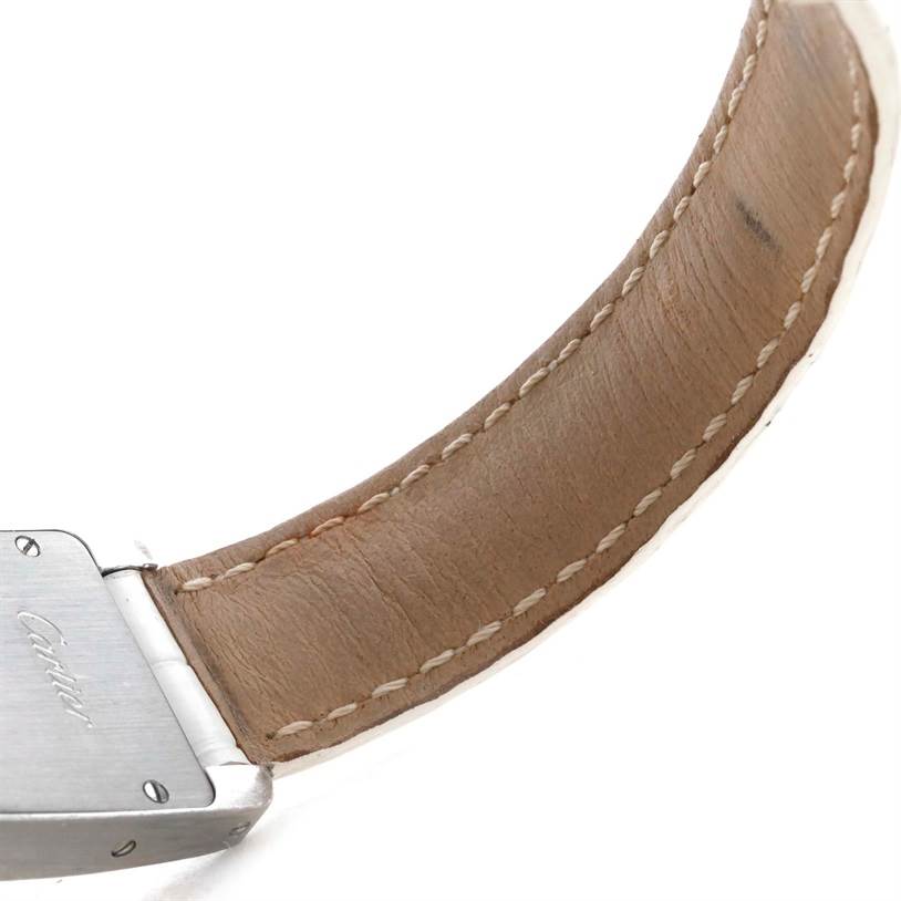 The image shows the leather strap and clasp of a Cartier Tank Americaine WB701851 Women
s White Gold Silver Dial WB701851 Women
s White Gold Silver Dial watch from a close-up angle.