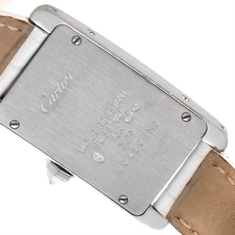 This image shows the back case and part of the strap of a Cartier Tank Americaine WB701851 Women
s White Gold Silver Dial WB701851 Women
s White Gold Silver Dial watch from a rear angle.