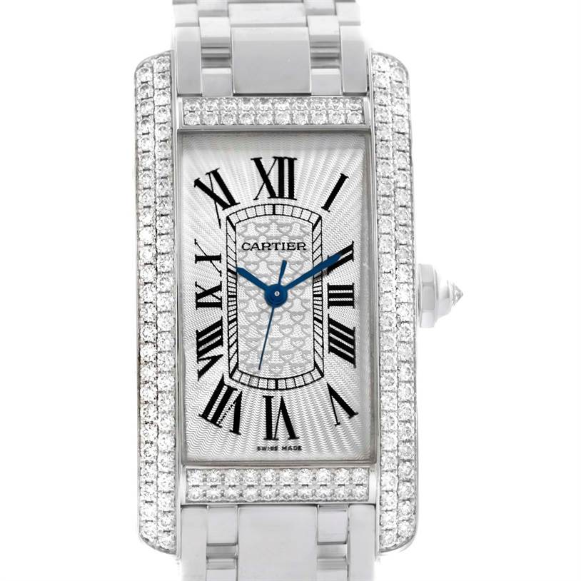 This Cartier Tank Americaine WB710001 Women
s White Gold Silver Dial WB710001 Women
s White Gold Silver Dial watch is shown from a front angle, displaying the face, bezel, and part of the bracelet.