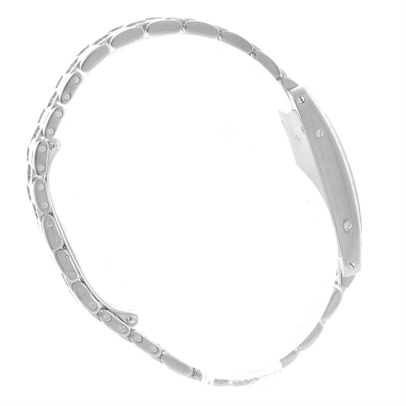 The image shows the Tank Americaine model by Cartier from a side view, highlighting the watch case and bracelet.