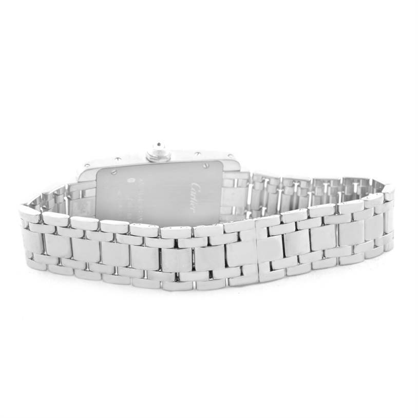 The image shows the back and partially open bracelet of a Cartier Tank Americaine WB7073L1 Women's White Gold Silver Dial WB7073L1 Women's White Gold Silver Dial watch.