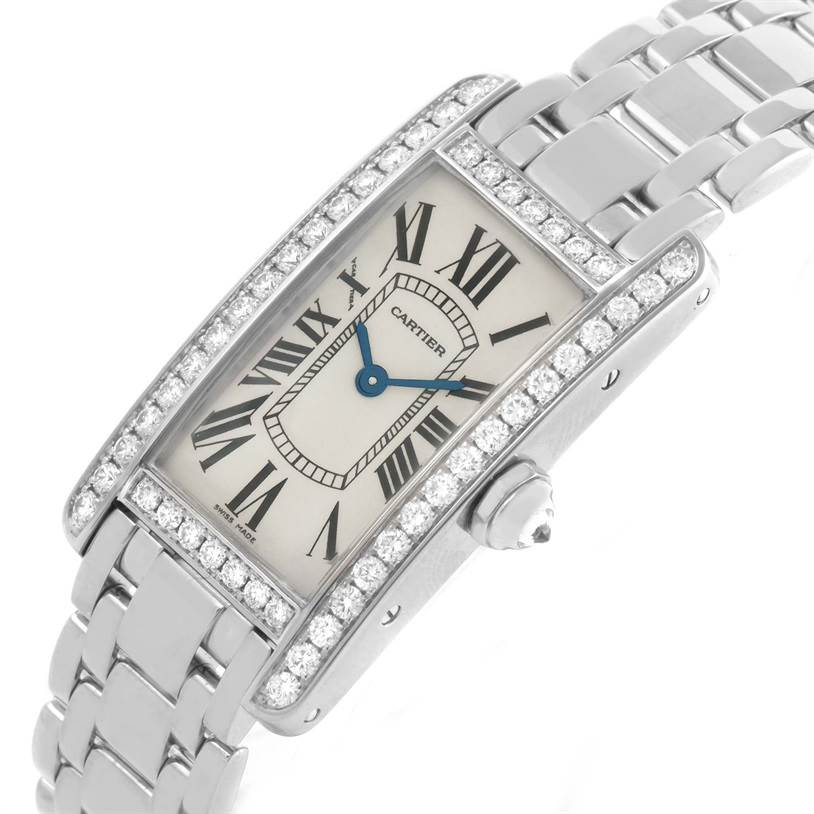 The image shows a slightly angled view of the face and band of a Cartier Tank Americaine WB7073L1 Women's White Gold Silver Dial WB7073L1 Women's White Gold Silver Dial watch, highlighting its rectangular dial and bracelet.