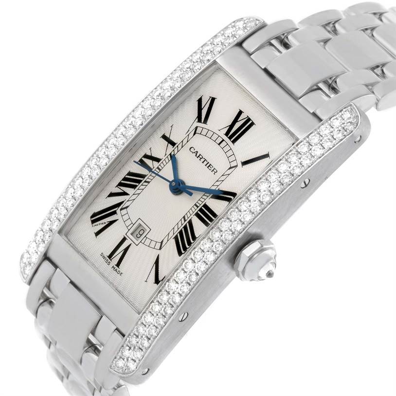 The image shows a Cartier Tank Americaine 2423 Women's White Gold Silver Dial 2423 Women's White Gold Silver Dial watch at a three-quarter angle, highlighting the face, diamond bezel, and metallic band.