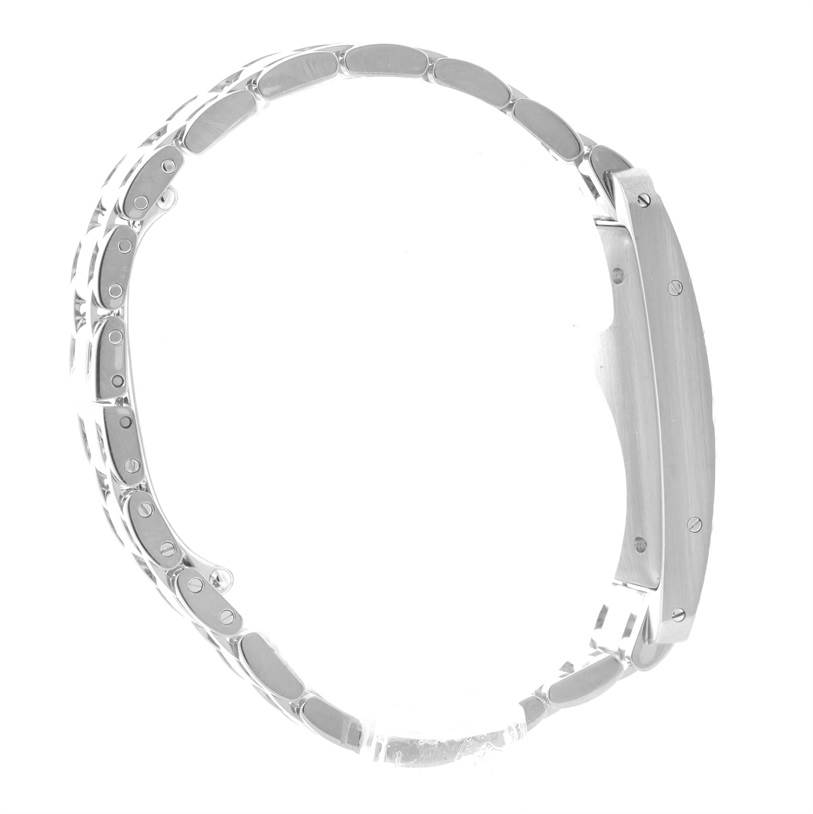 The image shows a side view of the Cartier Tank Americaine 2423 Women's White Gold Silver Dial 2423 Women's White Gold Silver Dial watch, highlighting its metal strap and the side of its case.