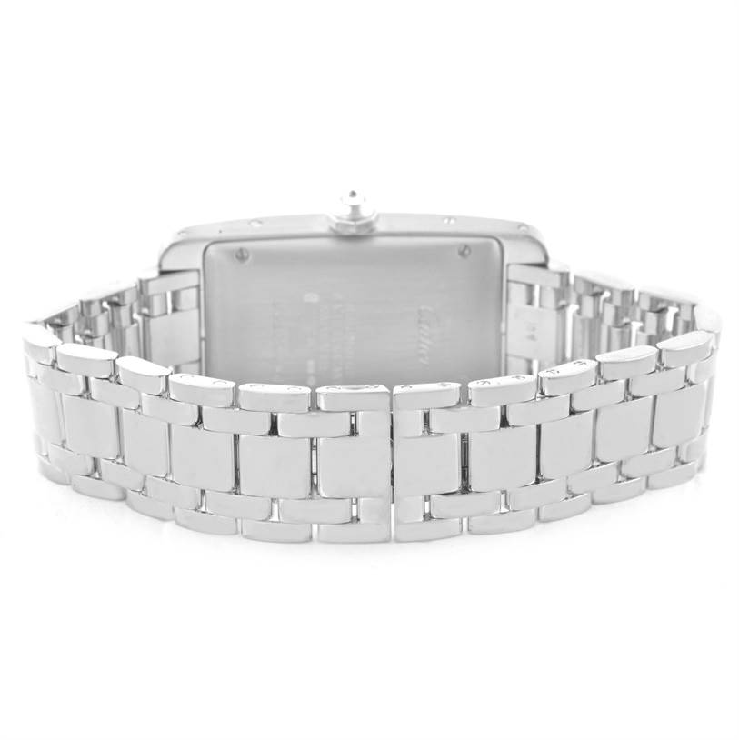 The image shows the back view of a Cartier Tank Americaine 2423 Women's White Gold Silver Dial 2423 Women's White Gold Silver Dial watch, highlighting its metal bracelet and case back.