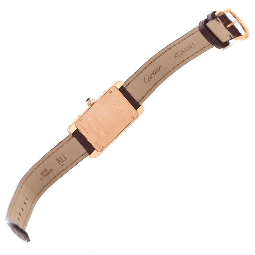This image shows the back case and leather strap of a Cartier Tank Americaine W2607456 Women's Rose Gold Silver Dial W2607456 Women's Rose Gold Silver Dial watch.