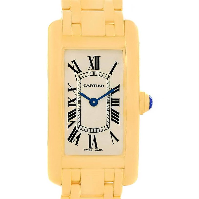 This is a front view of a Cartier Tank Américaine watch showing the dial, Roman numerals, and blue hands, with part of the gold bracelet visible.