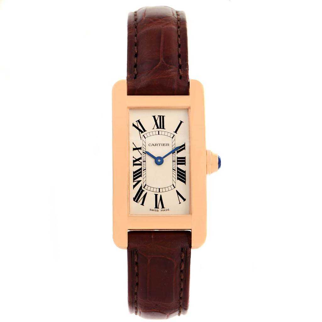 The image shows a Cartier Tank Américaine watch from the front, displaying its face and part of its brown leather strap.