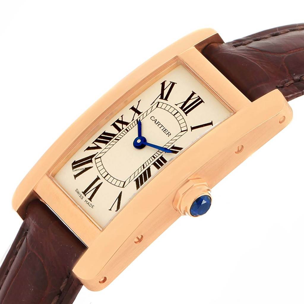The image shows an angled view of the Cartier Tank Americaine W2607456 Women
s Rose Gold Silver Dial W2607456 Women
s Rose Gold Silver Dial watch, highlighting the face, crown, and leather strap.