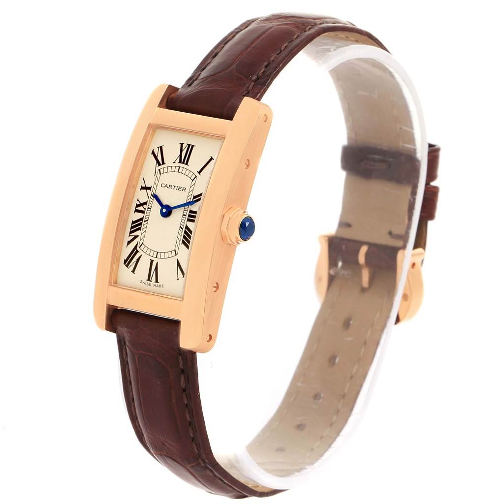 The Cartier Tank Americaine W2607456 Women
s Rose Gold Silver Dial W2607456 Women
s Rose Gold Silver Dial watch is shown at an angle displaying the face, crown, and strap.