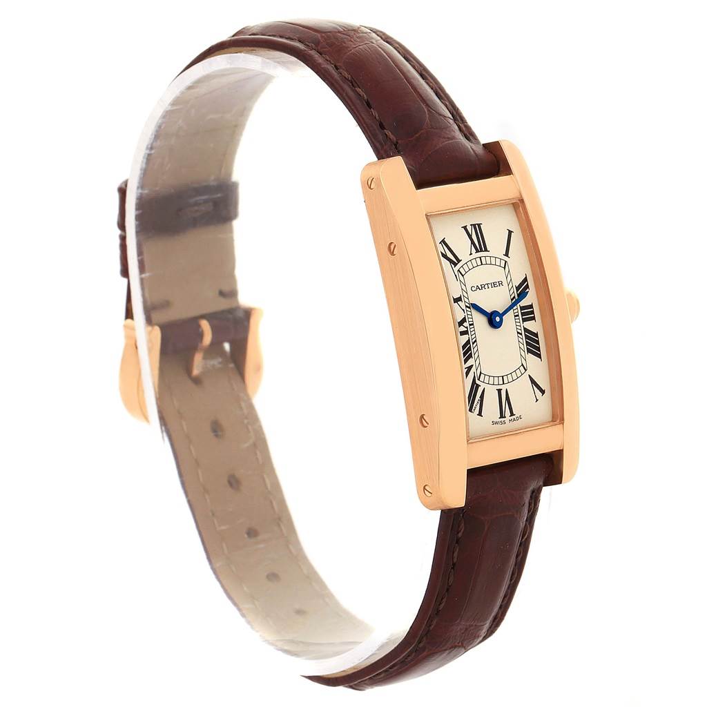 The Tank Americaine watch by Cartier is shown from a side angle displaying the face, strap, and part of the buckle.