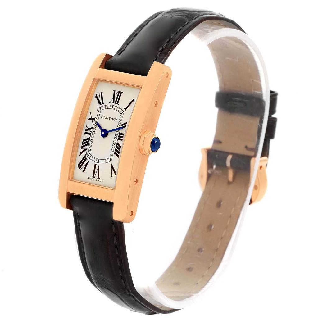 The Cartier Tank Americaine W2607456 Women
s Rose Gold Silver Dial W2607456 Women
s Rose Gold Silver Dial watch is shown at a three-quarter angle, displaying the dial, crown, and leather strap.