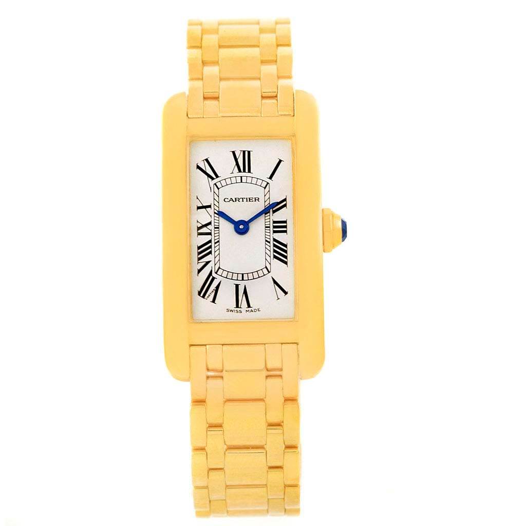 The image shows a full view of the Cartier Tank Americaine W26015K2 Women
s Yellow Gold Silver Dial W26015K2 Women
s Yellow Gold Silver Dial watch, highlighting its rectangular face, Roman numerals, and gold link bracelet.