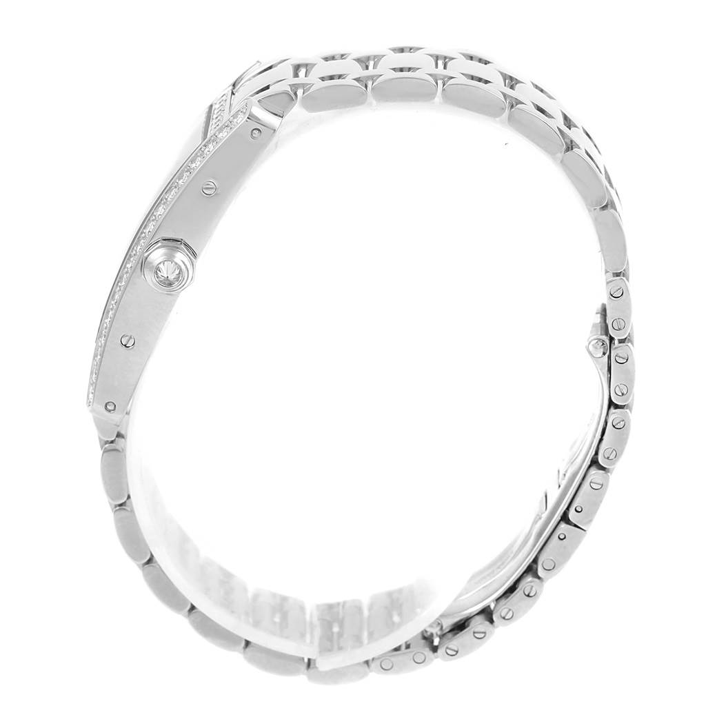 The image shows a side view of the Cartier Tank Americaine WB7073L1 Women's White Gold Silver Dial WB7073L1 Women's White Gold Silver Dial watch, highlighting its bracelet, crown, and case.