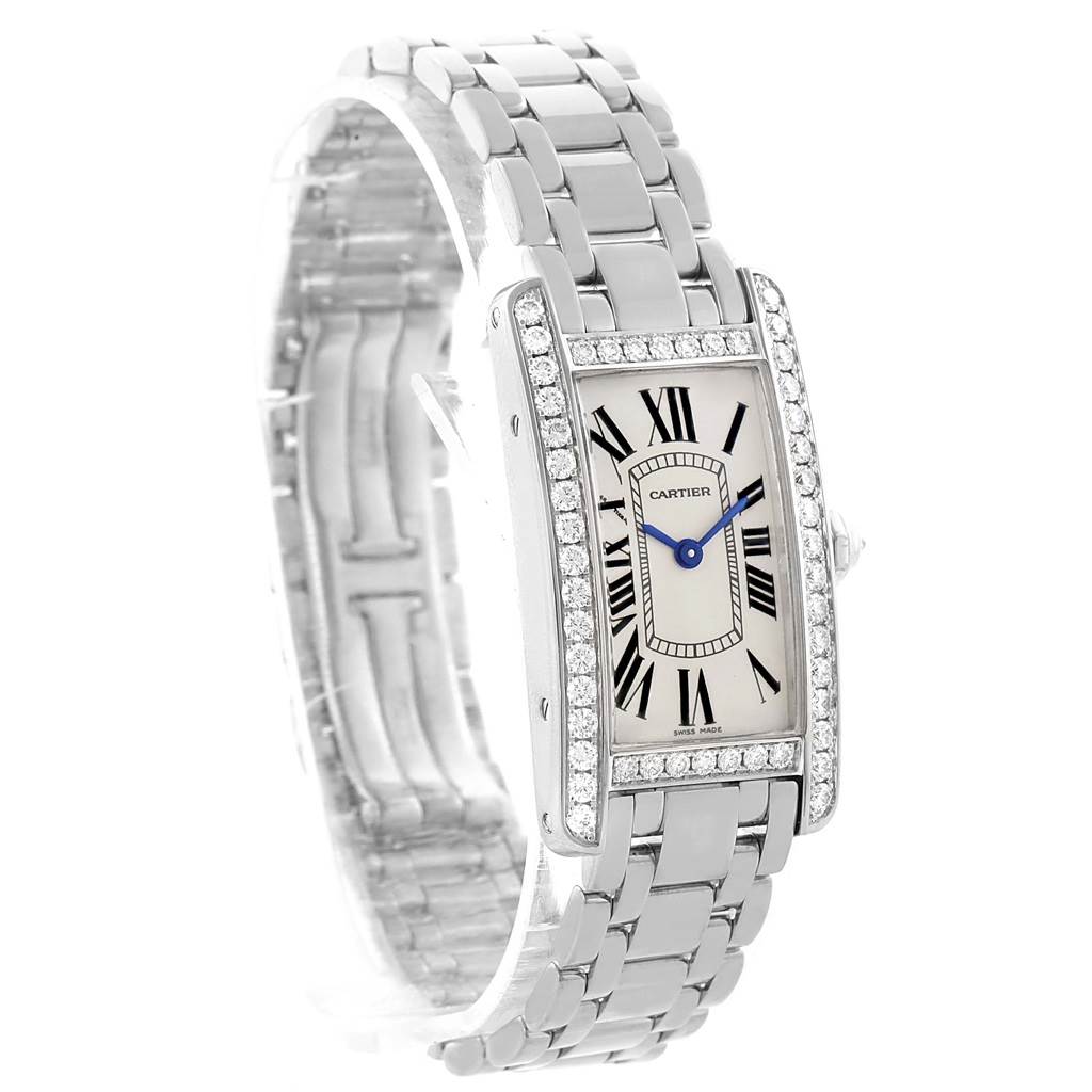 The image shows a Cartier Tank Américaine watch from an angled front view, highlighting its face, bezel, and bracelet.