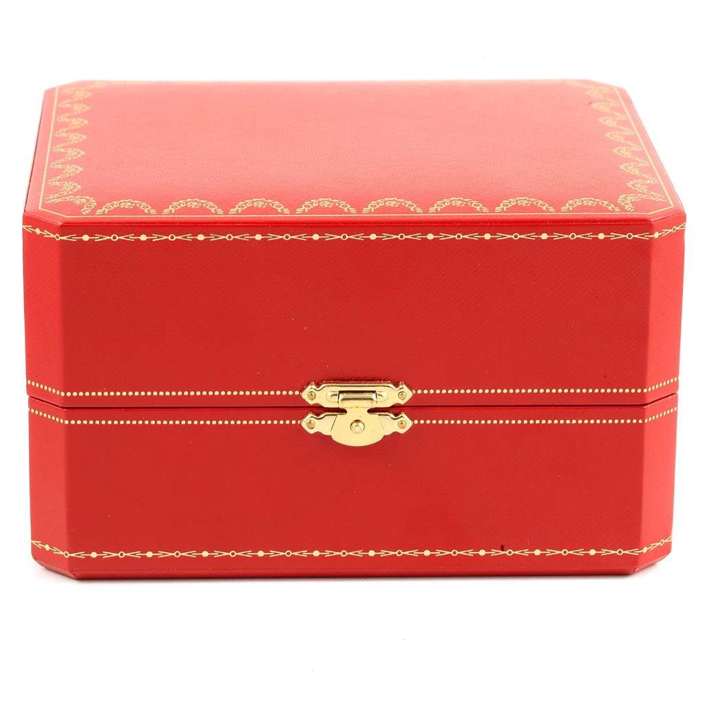 This image shows the Cartier Tank Americaine W26015K2 Women's Yellow Gold Silver Dial W26015K2 Women's Yellow Gold Silver Dial watch's red storage box with gold detailing, viewed from the front.