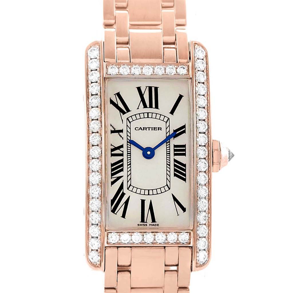 The image shows a frontal view of a Cartier Tank Americaine WB7079M5 Women's Rose Gold Silver Dial WB7079M5 Women's Rose Gold Silver Dial watch, highlighting its rectangular face, Roman numerals, and diamond accents.