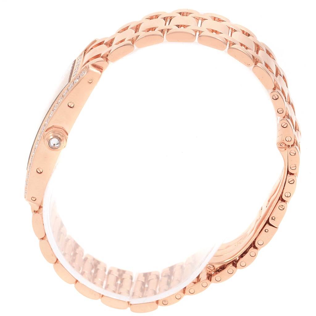 The image shows the side view of the Cartier Tank Americaine WB7079M5 Women's Rose Gold Silver Dial WB7079M5 Women's Rose Gold Silver Dial watch, focusing on the bracelet and crown with a prominent rose gold color.