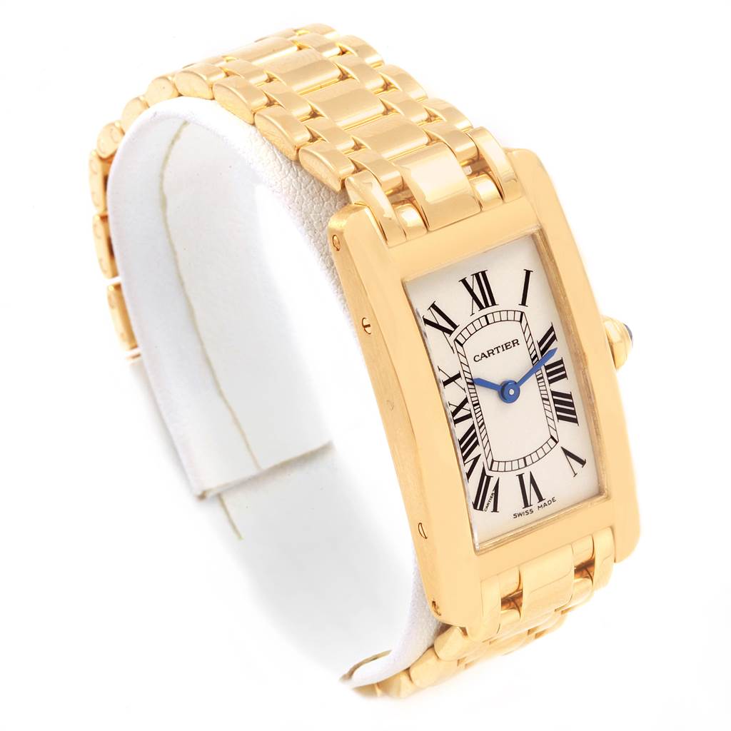 This image shows a Cartier Tank Americaine W26015K2 Women's Yellow Gold Silver Dial W26015K2 Women's Yellow Gold Silver Dial watch from a front angle, highlighting its rectangular face and gold bracelet.