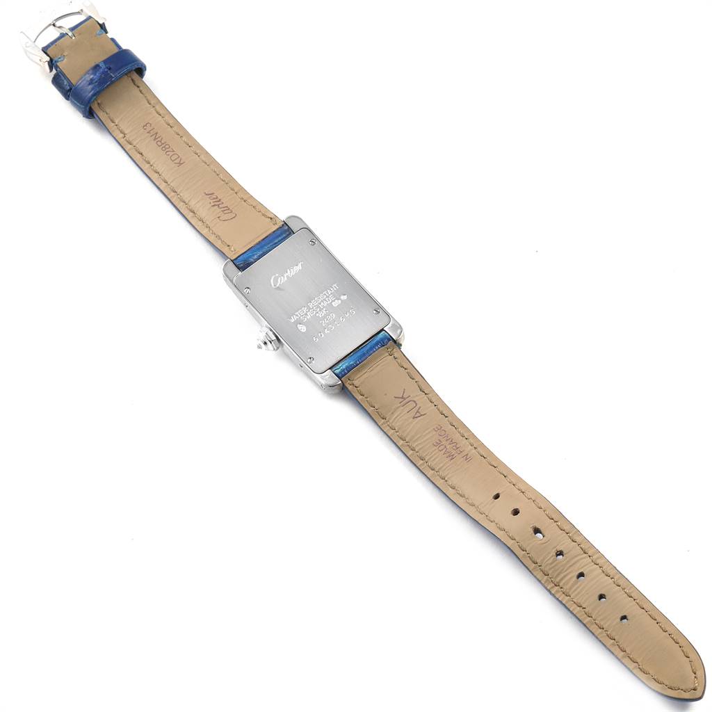 This image shows the back view of a Cartier Tank Américaine watch, highlighting the case back and leather strap.