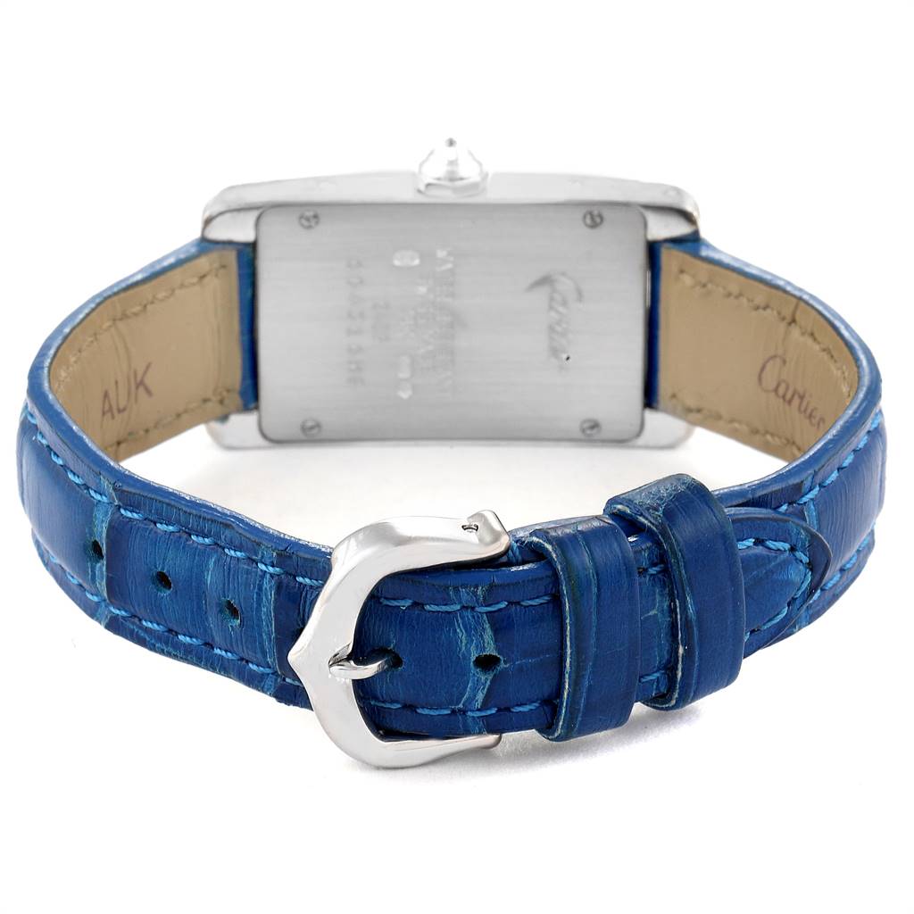 The image shows the back and clasp of a Cartier Tank Americaine WB701851 Women's White Gold Silver Dial WB701851 Women's White Gold Silver Dial watch with a blue leather strap.