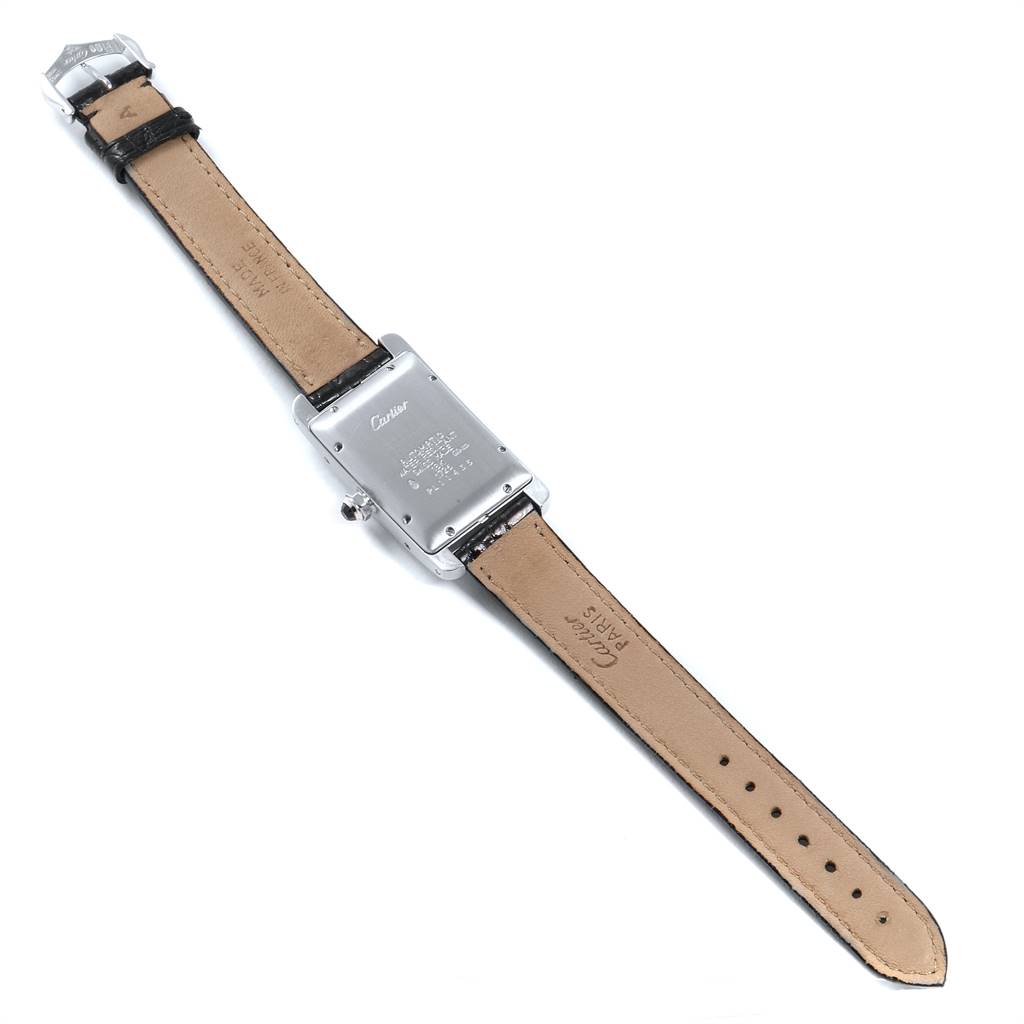 The image shows the back view of a Cartier Tank Americaine 1726 Women's White Gold Silver Dial 1726 Women's White Gold Silver Dial watch, detailing the case back and leather straps.