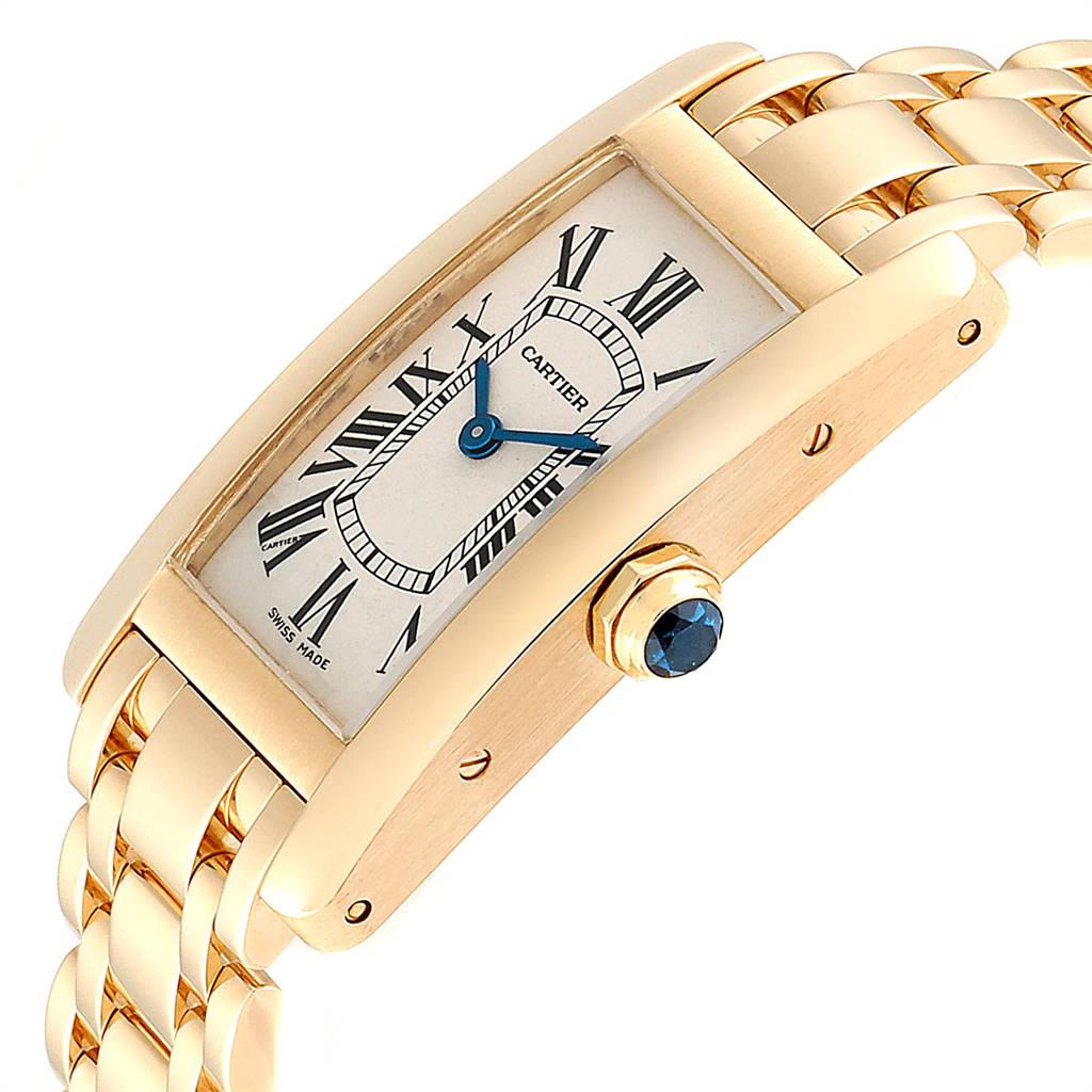 This image shows a close-up angled view of the Cartier Tank Américaine watch, highlighting the dial, bezel, crown, and part of the bracelet.