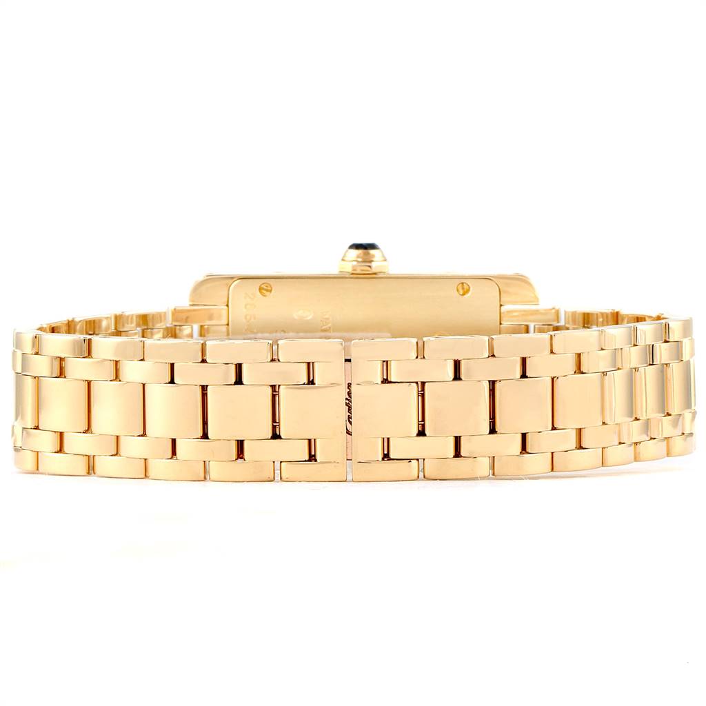This image shows the Tank Americaine watch by Cartier from the back, highlighting its gold bracelet and clasp.