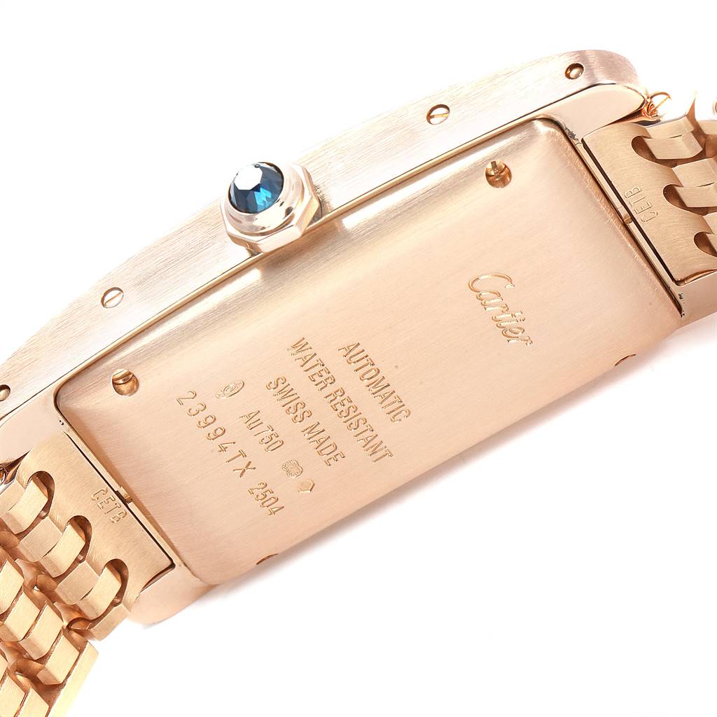 The image shows the back case and part of the bracelet of a Cartier Tank Américaine watch.