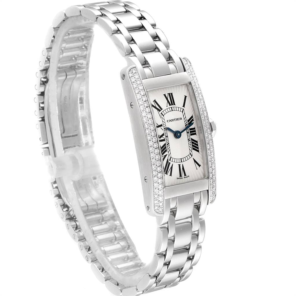 The image shows a Cartier Tank Américaine watch at a slight angle, displaying its face, case, and metal bracelet.