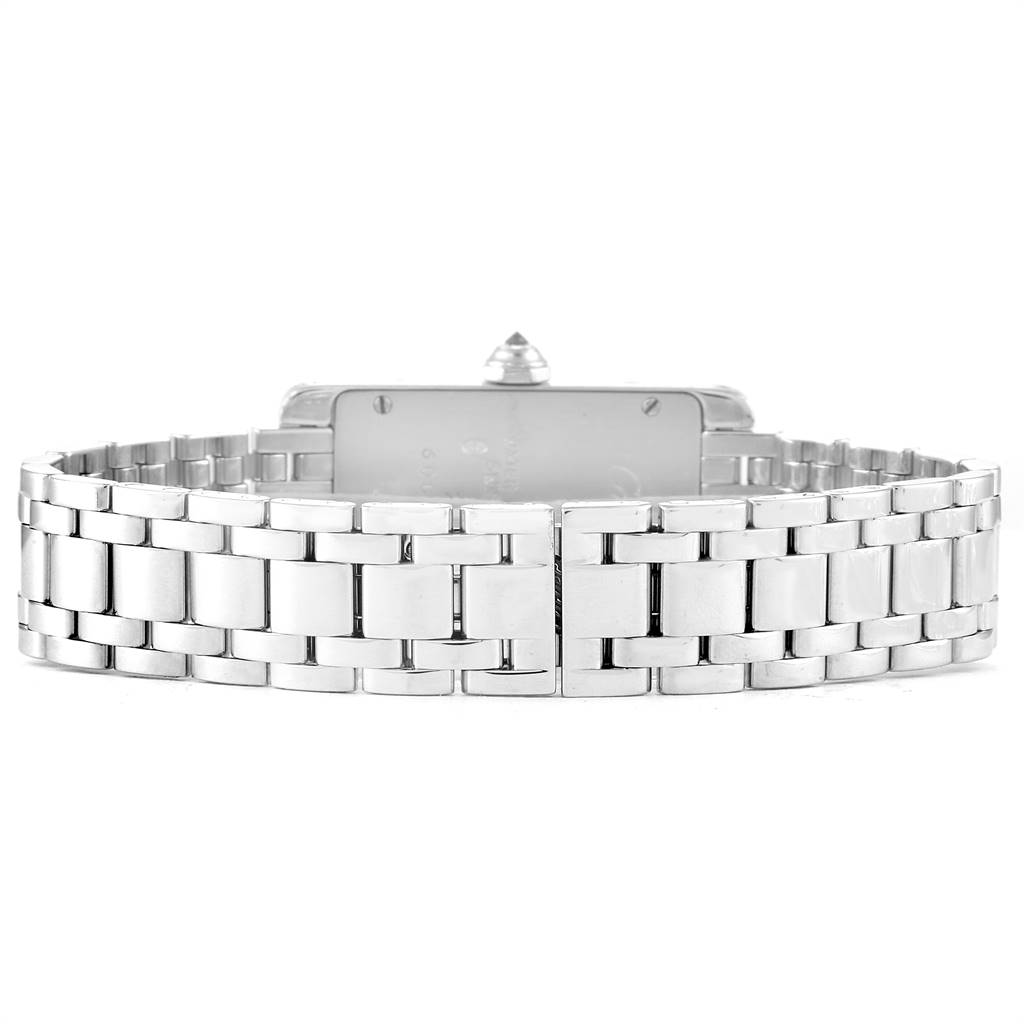 The image shows the Cartier Tank Americaine WB7018L1 Women's White Gold Silver Dial WB7018L1 Women's White Gold Silver Dial watch from a rear angle, highlighting its stainless steel bracelet and clasp.