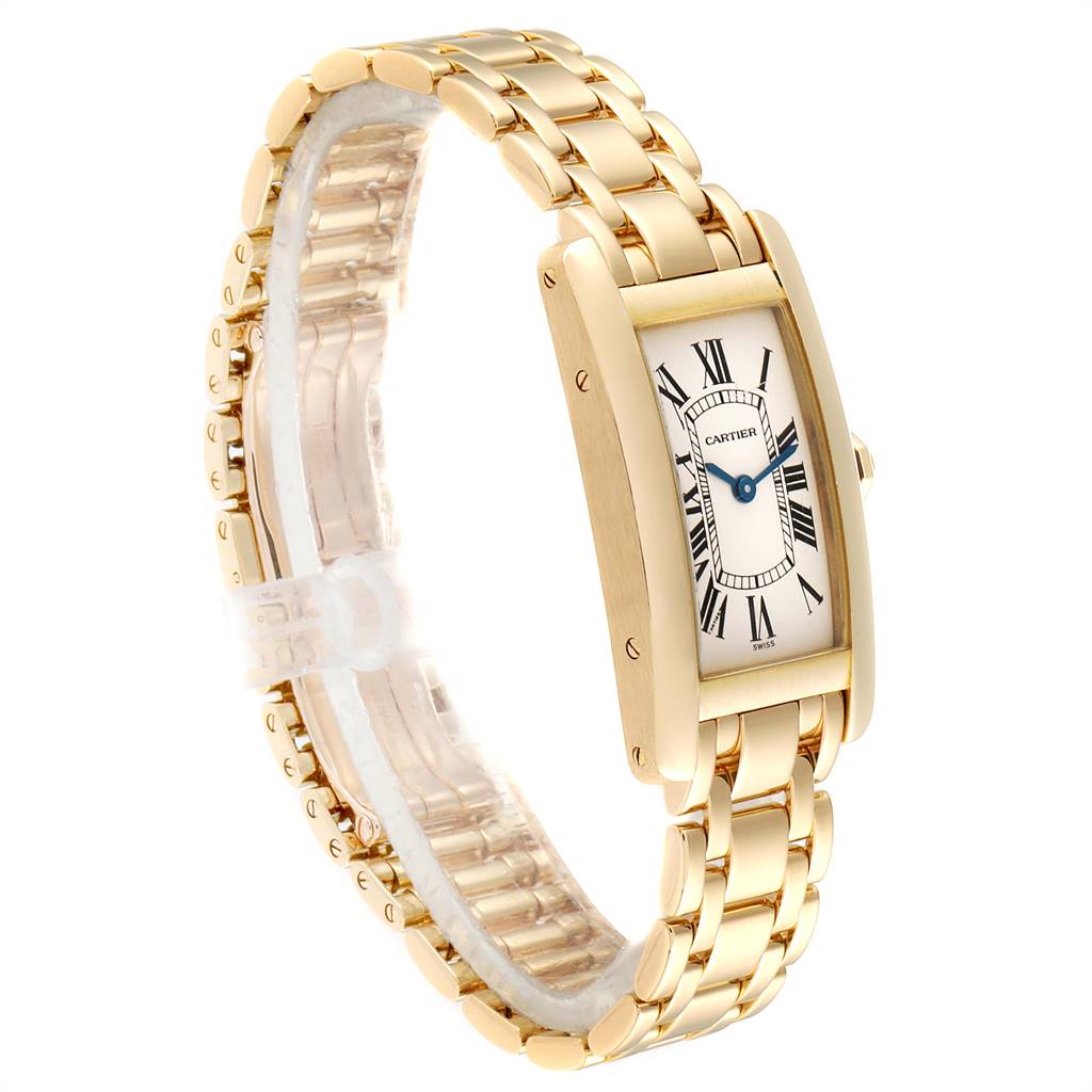 The image shows a side view of the gold Cartier Tank Americaine W26015K2 Women
s Yellow Gold Silver Dial W26015K2 Women
s Yellow Gold Silver Dial watch, including its linked bracelet and rectangular face with Roman numerals.