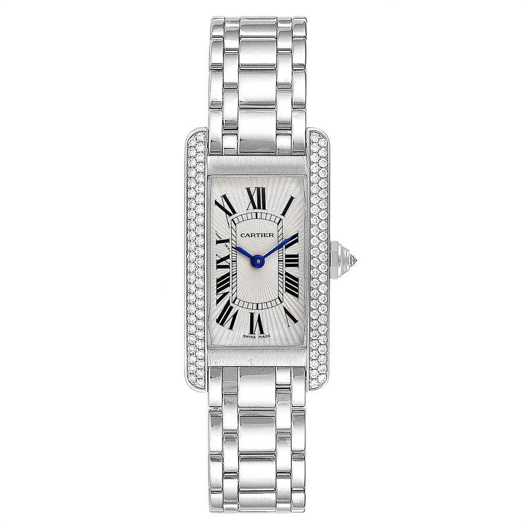The image shows a Cartier Tank Americaine WB7018L1 Women
s White Gold Silver Dial WB7018L1 Women
s White Gold Silver Dial watch from a top-down angle featuring the face, dial, and bracelet.